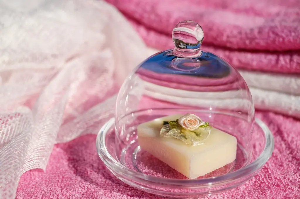 Glass cloche dome on pink linen
